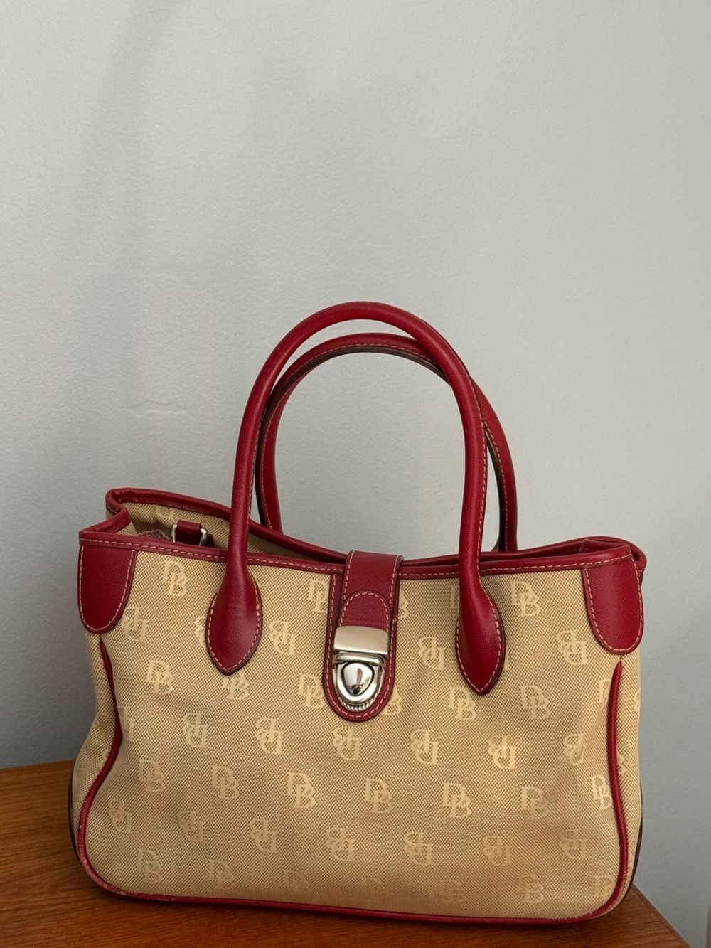 Dooney & Bourke Beige Canvas Satchel with Red Leather Trim and Handles